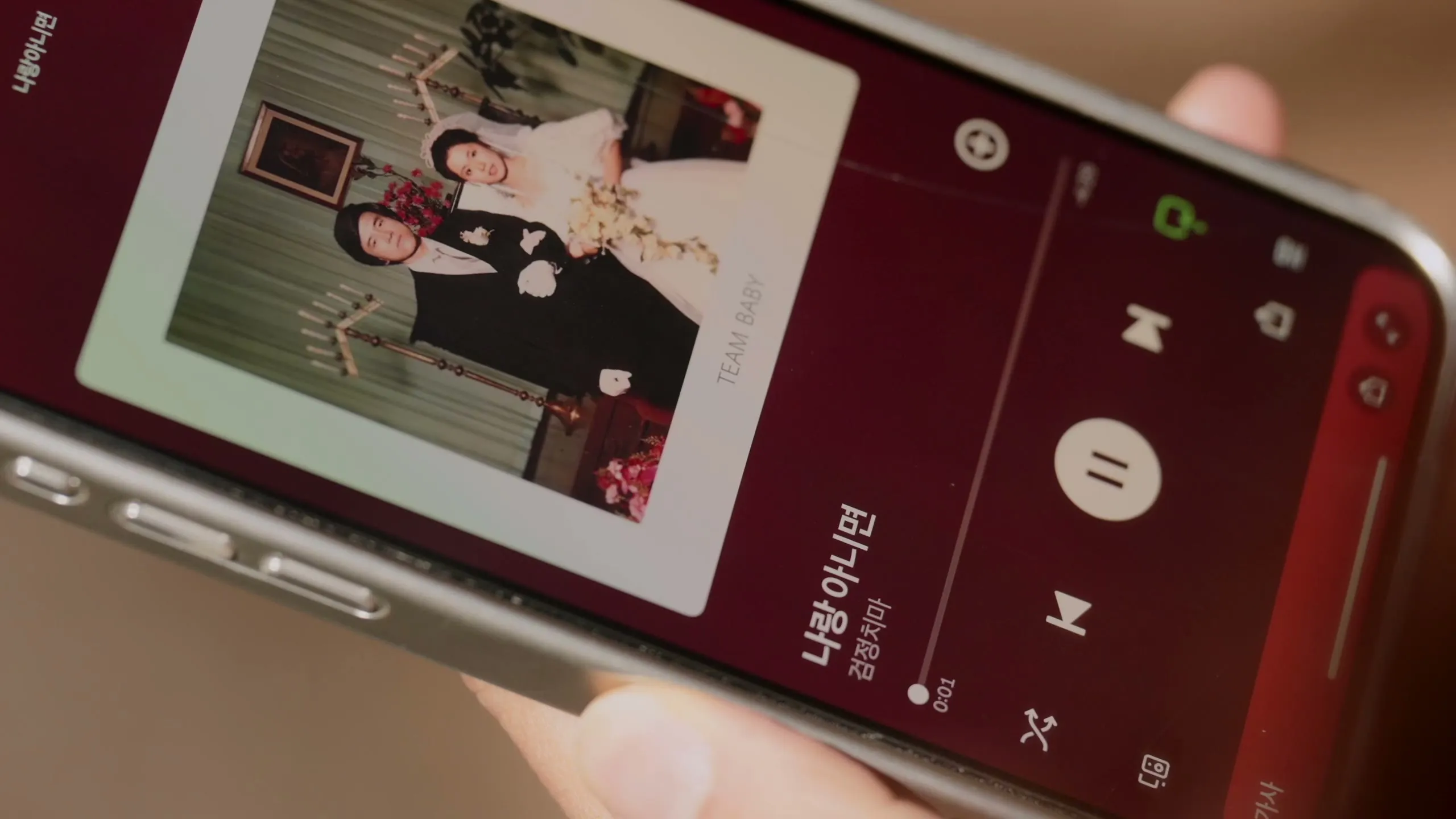 The proposal song, queued up on his phone in the car