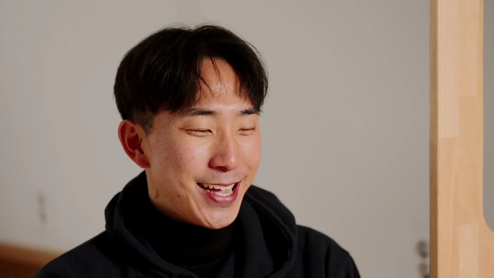 Taehoon answering a question on camera