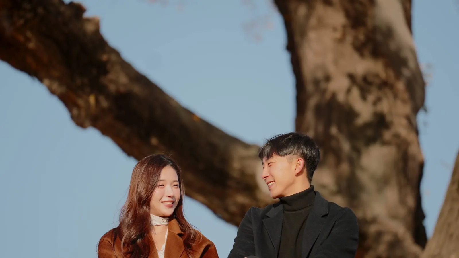 The two of them, interviewed under the trees