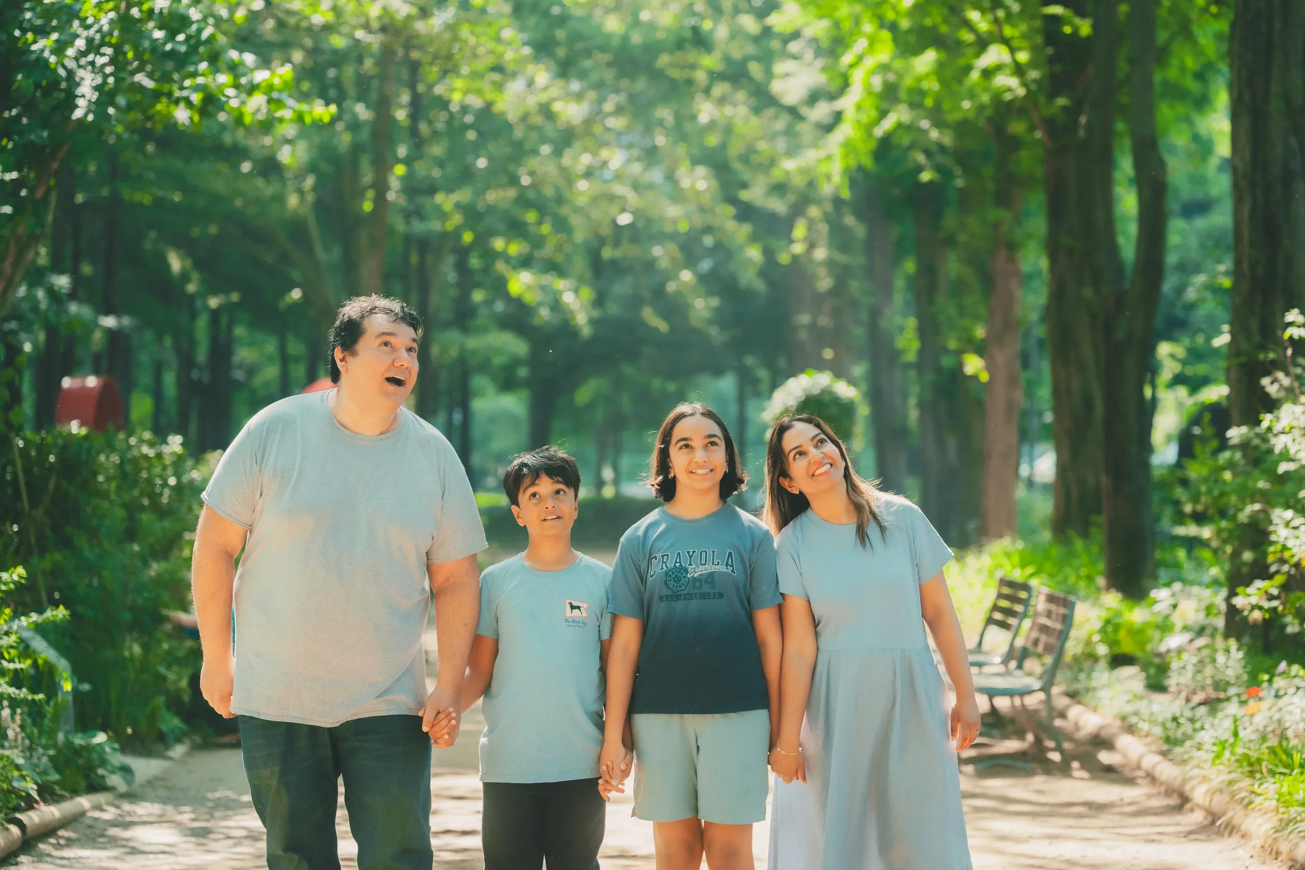 The four of them walking a Seoul Forest path