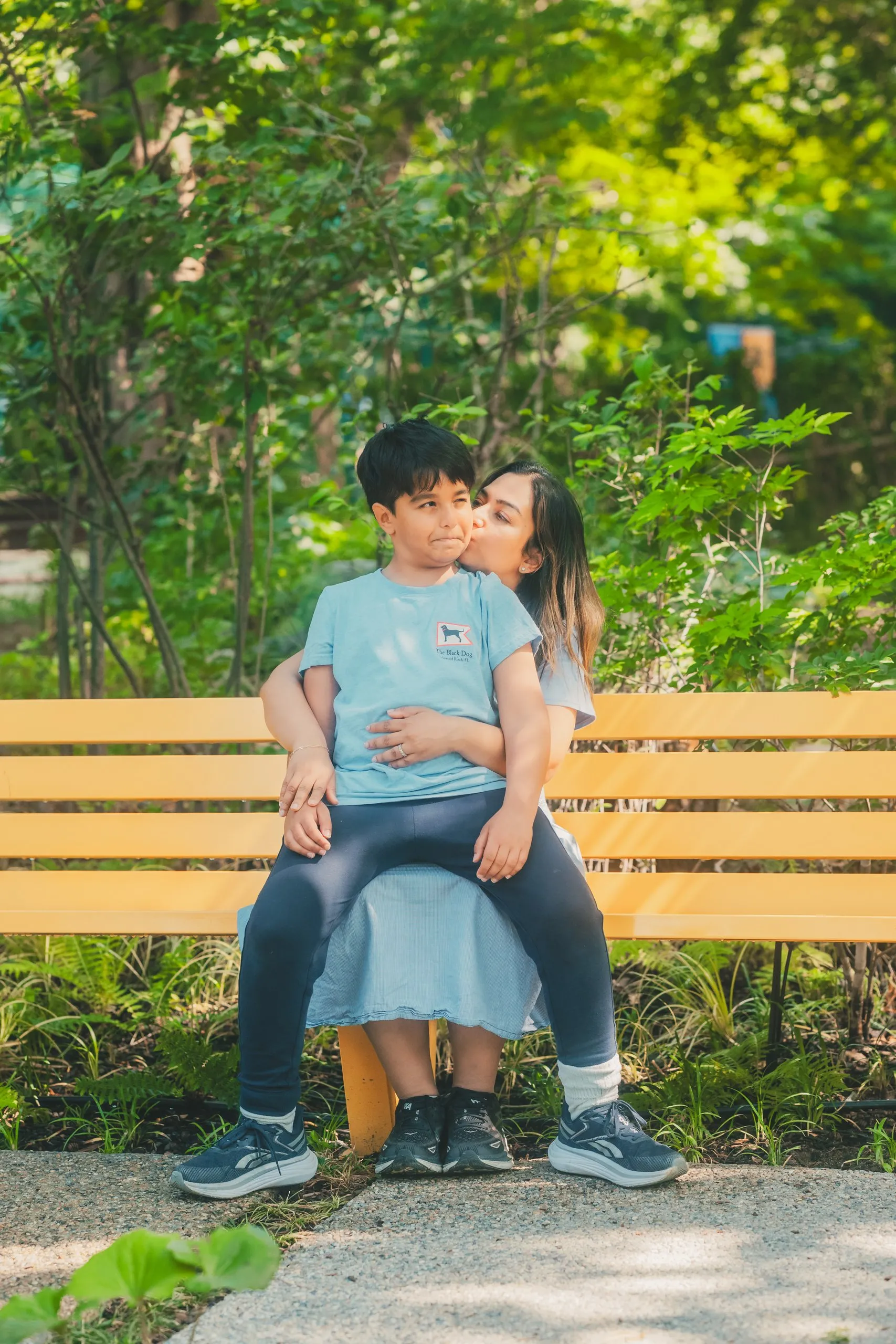 Amal with Ali on a bench in Seoul Forest