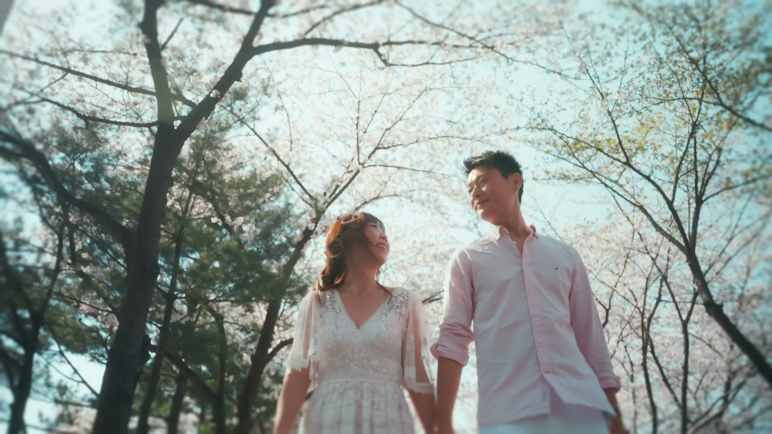 Christy and her partner in the cherry blossoms at Seonyudo