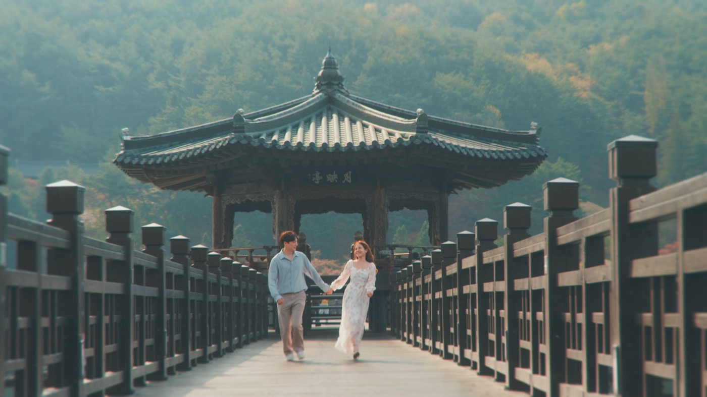 A couple on a wooden bridge in Andong.