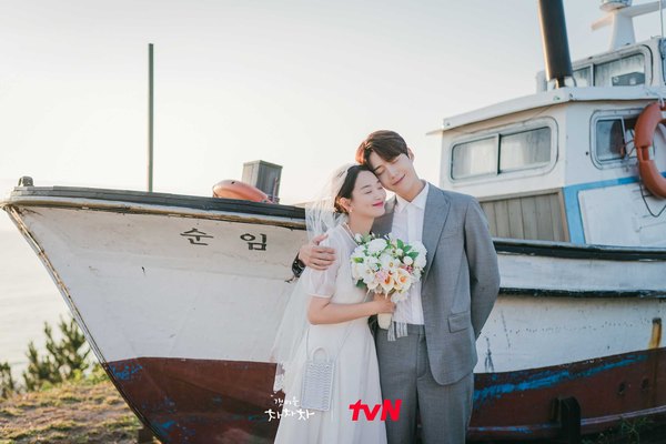 Hometown Cha-Cha-Cha: Du-sik and Hye-jin by his boat at Sabang Memorial Park, Pohang.